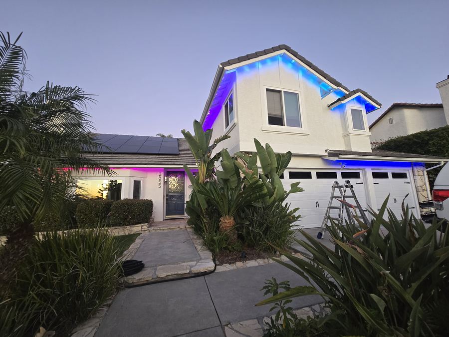 Roofline glowing blue and purple at dusk